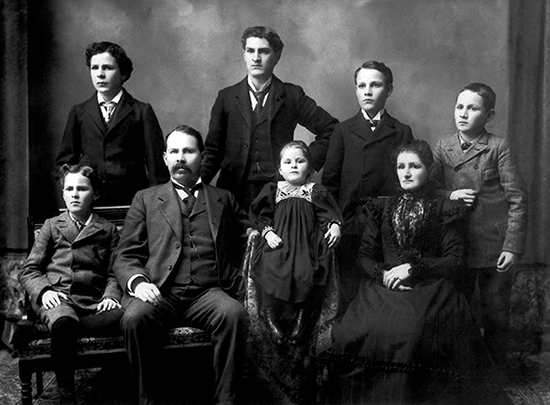 Leopold and Johanna Schmidt, both born and raised in Germany, pose with their six children in a portrait taken in the late 1890s. The tallest boy is their oldest son, Peter, who inherited the family home.